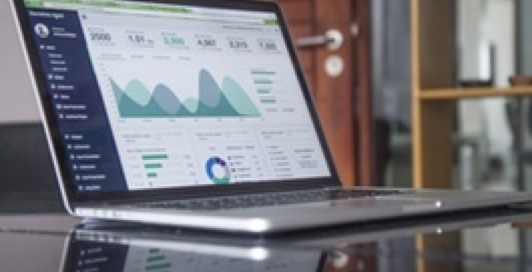 A laptop showing a data display