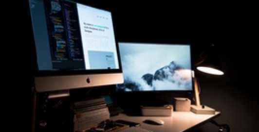 Two monitors on a desk