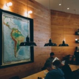 Classroom full of a lecturer and some students learning